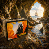 The Goonies lunch box on a rock with a cave and ship in the background