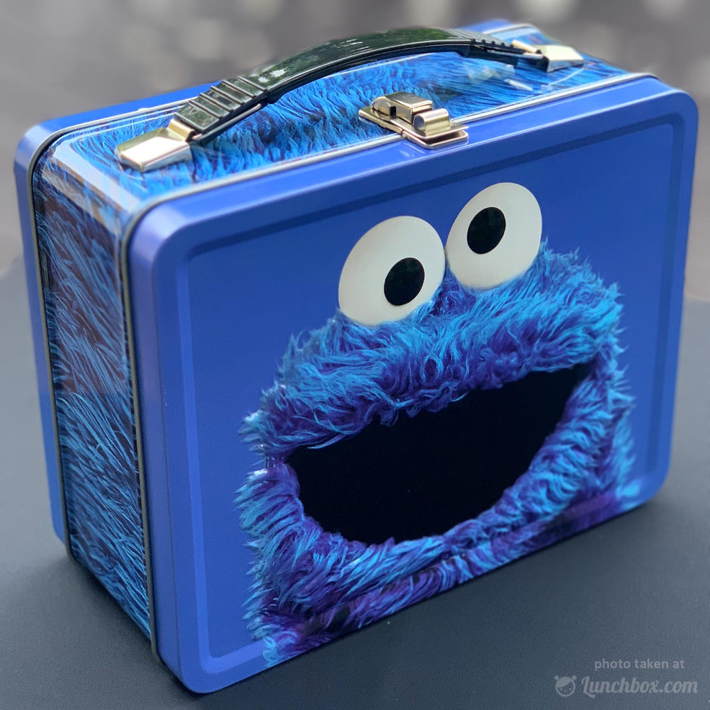 https://www.lunchbox.com/cdn/shop/products/cookie-monster-lunch-box_205a2d7f-24b8-455c-ae97-9a8ccf438069_1024x1024.jpg?v=1604723010